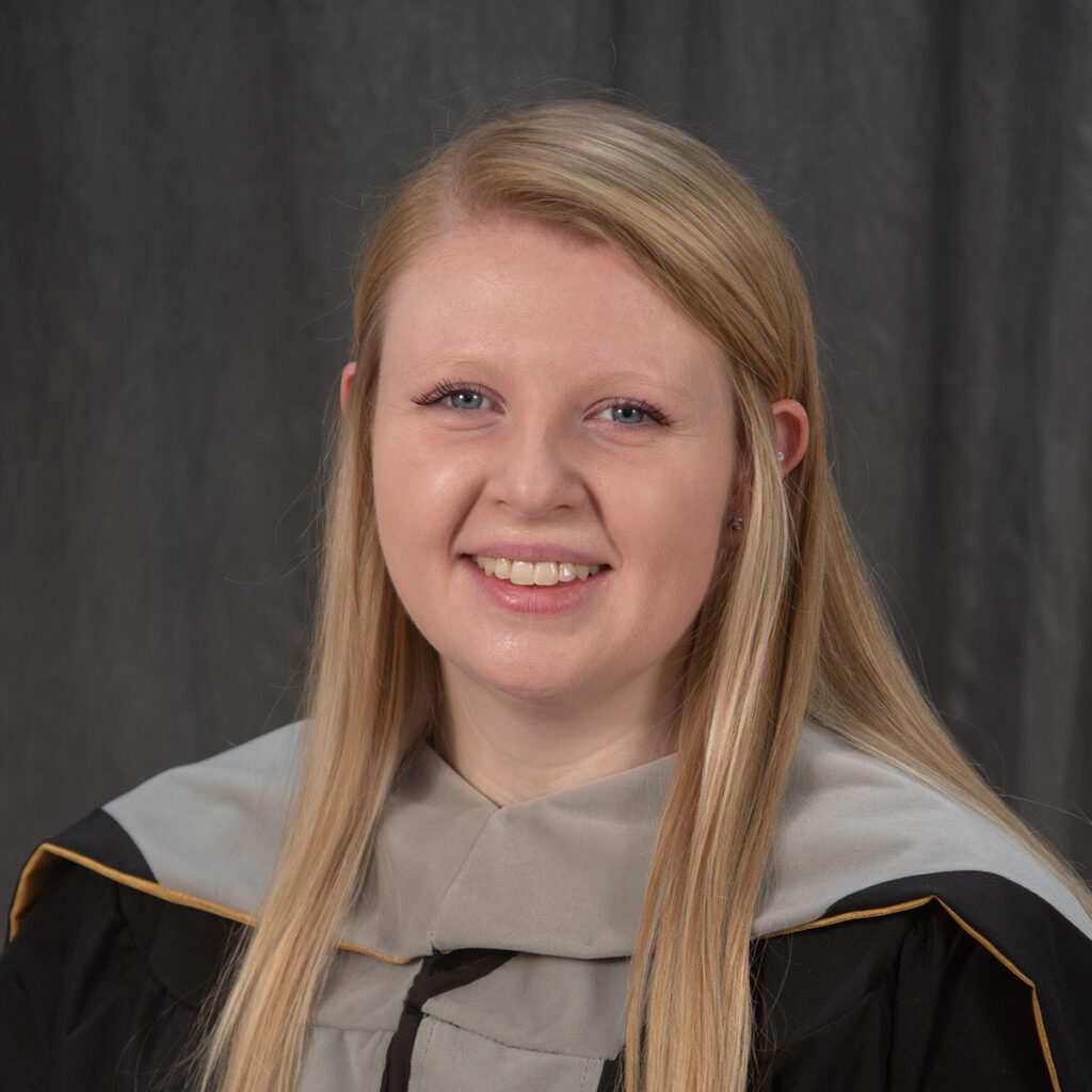 close up graduation photo of smiling young woman