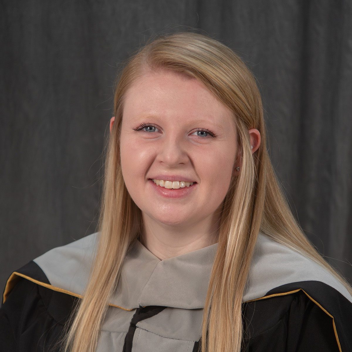 close up graduation photo of smiling young woman